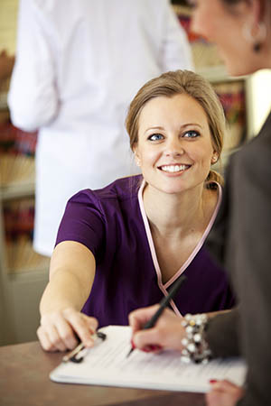 A customer service woman smiling at a customer